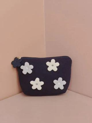 Airy Moco Flower Pouch with navy fabric and white flower appliqués, perfect for storing essentials, by Gelato Pique.