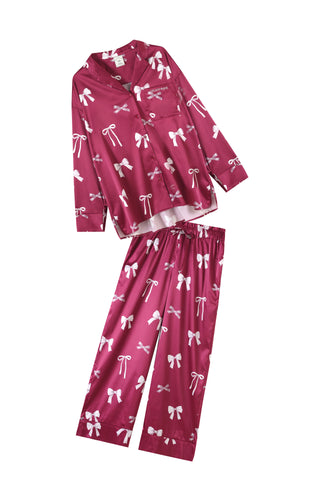 Pink ribbon print shirt and pants set with notched collar and button closure.