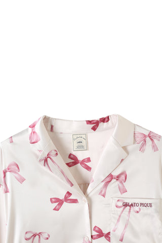 Ribbon pattern satin shirt dress with pink bow print and luxurious silky texture.