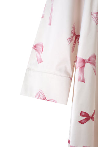 Close-up of Ribbon Pattern Satin Shirt Dress with pink bow print, showcasing premium silky fabric and elegant design.