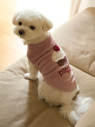 Small dog wearing a pink CAT&DOG Cupcake Sleeveless Pet Clothes sweater with cupcake design.