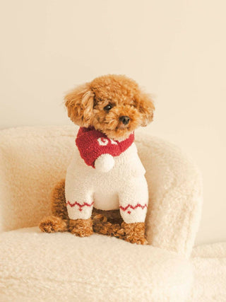 Cute dog wearing a cozy white and red CAT&DOG Baby Moco Muffler, sitting on a soft beige chair.