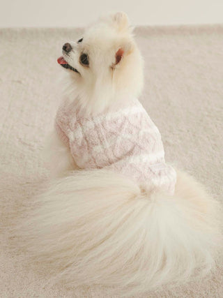 Fluffy dog wearing CAT&DOG Baby Moco Aran Pet Clothes, sitting on a cream carpet. Perfect cozy attire for pets.