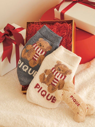 Cozy Pique bear-themed socks set in gift box, featuring grey and white designs with a bone-shaped plush toy, perfect holiday gift idea.