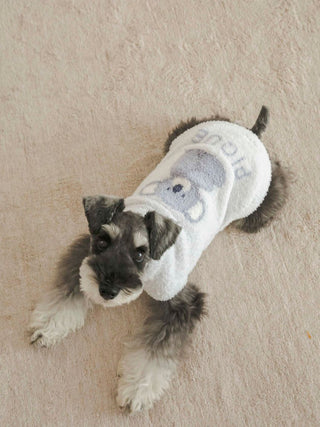 Small dog wearing CAT&DOG Baby Moco Animal Pet Clothes with a cute character print, lying on a beige carpet.