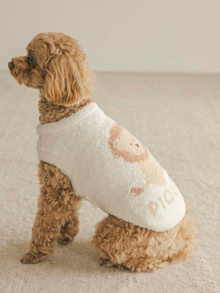 Small dog wearing CAT&DOG Baby Moco Animal Pet Clothes in white with bear design, sitting on a beige carpet.