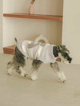 Schnauzer wearing grey CAT&DOG premium loungewear and sleepwear by Gelato Pique USA, walking indoors on a smooth floor.