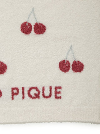 Close-up of cherry pattern on CAT & DOG pet blanket fabric, showcasing red cherries on a cream background. Smoothie cherry theme.