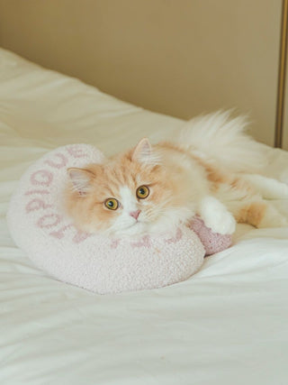 Fluffy cat resting on Baby Moco Ice Motif Pet Pillow on a bed