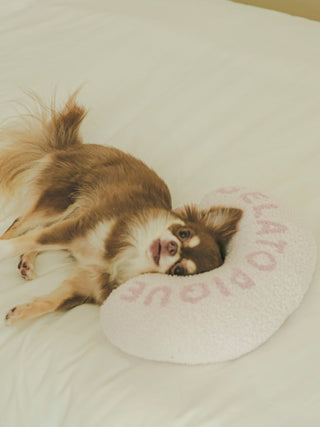 Brown dog resting on Gelato Pique USA white premium loungewear pet pillow with pink ice motif, perfect for sleepwear comfort.