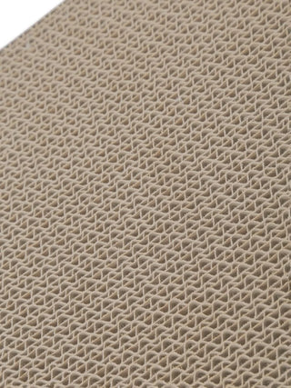 Close-up of beige cat pattern scratching board, showcasing texture and unique design for cat grooming.