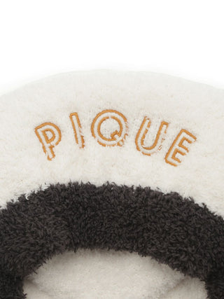 Gelato Pique USA cozy white and black panda hair bonnet, premium loungewear and sleepwear accessory, close-up of embroidered logo.