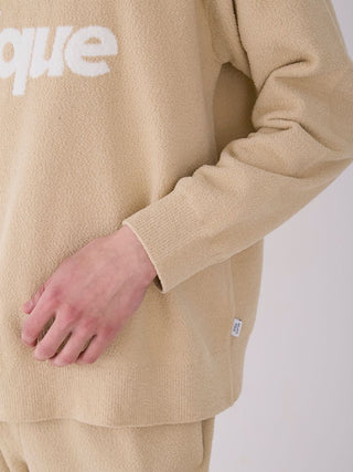 Close-up of Gelato Pique MENS Air Moco Logo Sweatshirt in beige, featuring jacquard logo design and soft fabric texture.