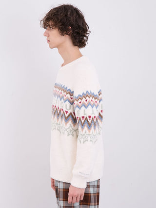 Side view of a man wearing a cozy white Fair Isle jacquard pullover sweater with a colorful pattern, styled for winter fashion.