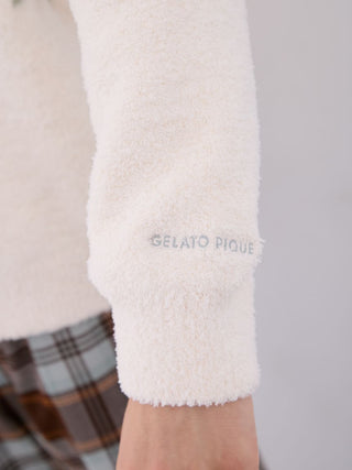 Close-up of Gelato Pique Powder Fair Isle Jacquard Pullover Sweater sleeve detail, showcasing soft texture and logo embroidery.