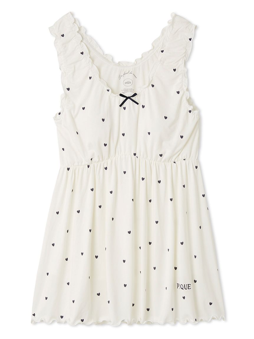 Gelato Pique women’s white sleeveless babydoll pajama top featuring black heart pattern, ruffled edges, ribbon bow at neckline, and embroidered logo.