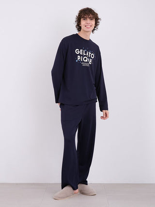 Man wearing Gelato Pique Mens Inlay Star Logo Lounge Pants and matching top, showcasing comfortable home relaxation wear.