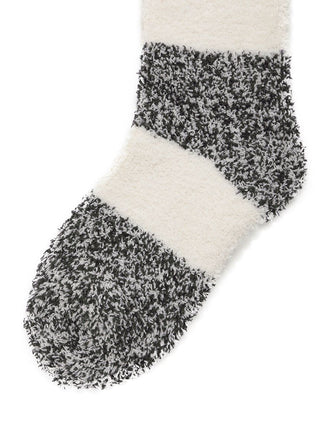 Mens Powder Melange Striped Fuzzy Socks, featuring black and white textured stripes, offer comfort and style with soft plush fabric.