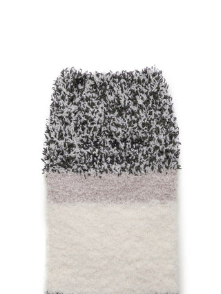 Close-up of black and white powder melange striped fuzzy sock, showcasing plush, soft texture for ultimate comfort and warmth.