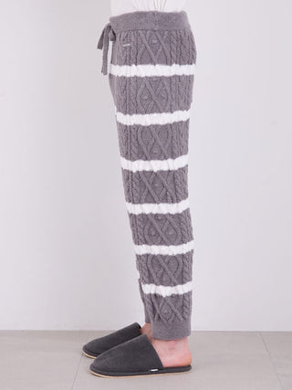 Side view of men's Baby Moco Aran striped cable knit pajama pants in gray, showcasing Aran pattern and plush fabric for cozy style.