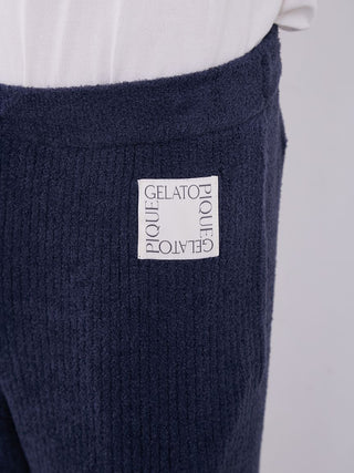 Close-up of MEN's Hot Smoothie Rib Long Pants showcasing the Gelato Pique label and rib-knit texture for warmth and style.