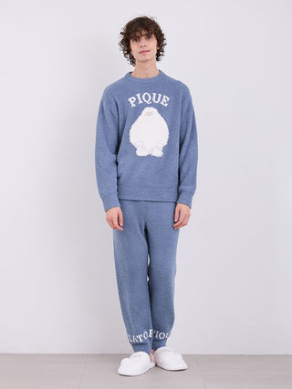 Model wearing blue Gelato Pique pajamas with logo, crafted from ultra-soft fabric, stylishly showcasing cozy winter loungewear.