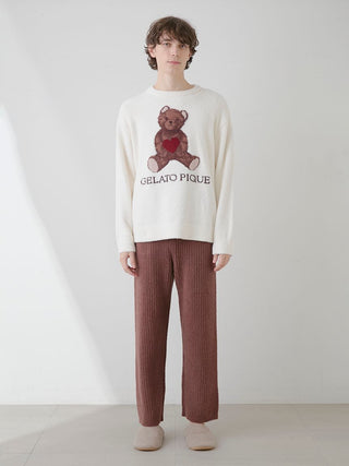 Man wearing Gelato Pique USA brown ribbed lounge pants with cozy bear motif sweater. Premium loungewear and sleepwear.