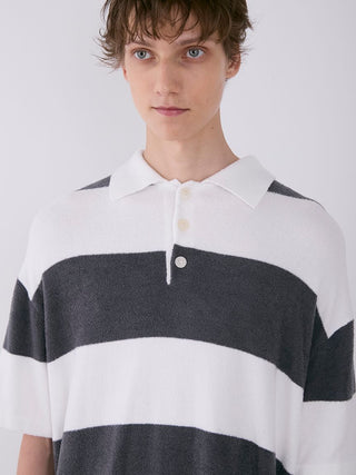 Model wearing Gelato Pique MEN'S Smoothie Relax Fit Striped Polo Shirt in grey and white with broad horizontal stripes.