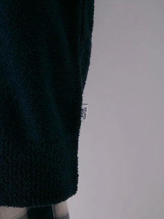 Close-up of dark blue Air Moco Aran Pullover Sweater showcasing texture and Gelato Pique label