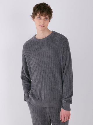 Model wearing Smoothie Relaxed Fit Ribbed Knit Sweater in gray, showcasing the soft, luxurious fabric and casual silhouette.