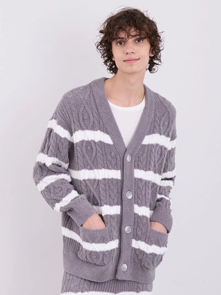 Man wearing a Gelato Pique Baby Moco Aran Border Button-Up Cardigan with cable knit and stripes, showcasing comfort and modern style.