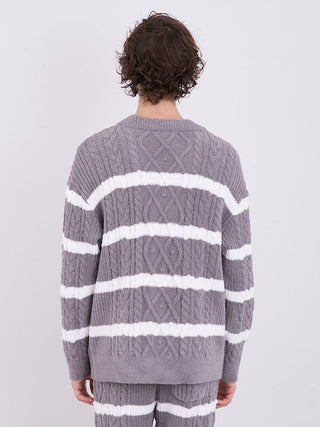 Back view of a men's cardigan with Aran cable knit pattern and white horizontal stripes, showcasing unique design and cozy fabric.