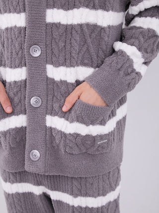 Close-up of gray and white striped Aran cable knit cardigan with button-up front and pocket, showcasing soft Baby Moco fabric texture.