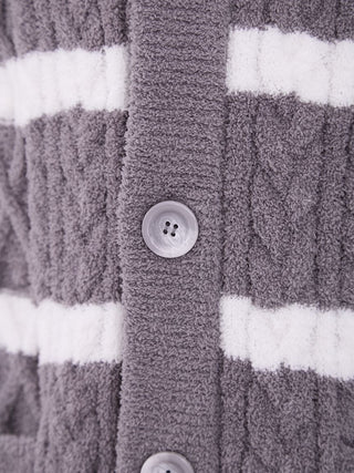 Close-up of gray and white Aran border knit pattern on Gelato Pique Baby Moco men's cardigan, featuring button details.