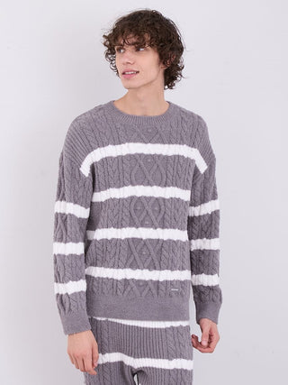 Model wearing a Men's Baby Moco Aran Border Pullover Sweater in gray with white stripes, featuring a cable-knit design for stylish comfort.