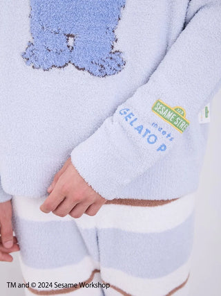 Close-up of Sesame Street men's motif pullover and lounge pants in soft 'Baby Moco' fabric, featuring original artwork.