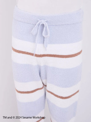 Close-up of Sesame Street men's lounge pants with soft 'Baby Moco' fabric, featuring gentle pastel stripes and tie waist design.