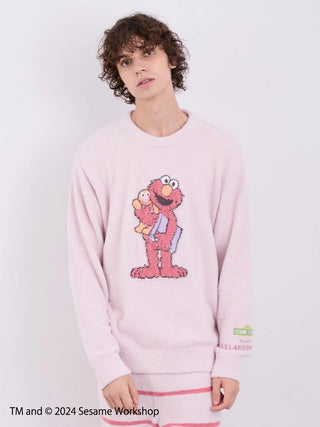 Man wearing Sesame Street motif pullover featuring Elmo, made from soft 'Baby Moco' fabric, part of loungewear set.