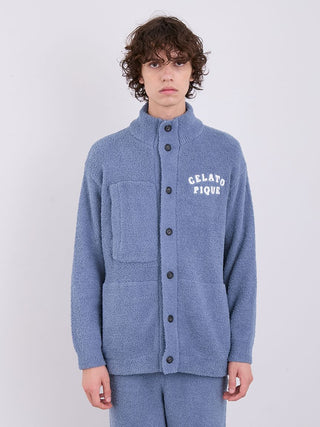 Man wearing blue Gelato Pique Monster Button-Front Lounge Cardigan with patch pocket detail, perfect for cozy relaxation.