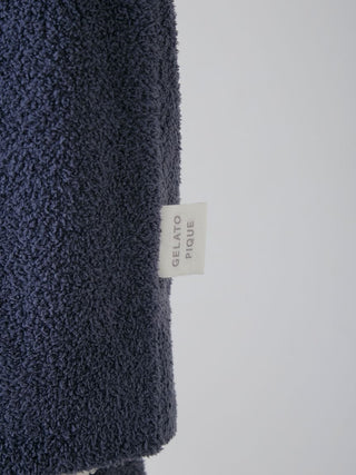 Close-up of navy Gelato Pique USA sweater sleeve, showcasing plush texture. Premium loungewear and sleepwear.