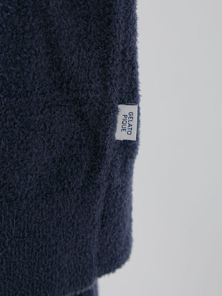 Close-up of navy Gelato Pique USA label on premium loungewear, featuring the smooth texture of a men's thermal pullover sweater.