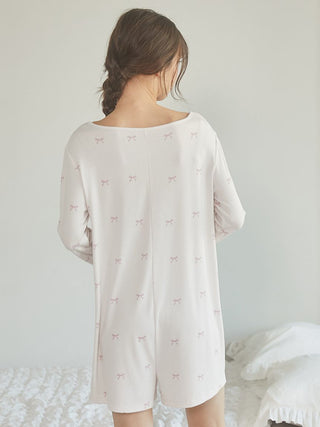 Back view of woman wearing off-white Motif 3-Pattern Romper by Gelato Pique USA, showcasing premium loungewear and sleepwear design.