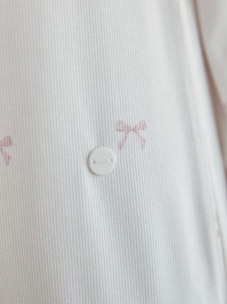 Close-up of off-white ribbed fabric with bow patterns from Gelato Pique USA Premium Loungewear and Sleepwear collection.