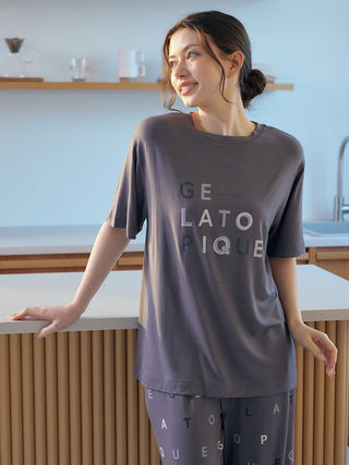 Woman wearing Gelato Pique USA premium loungewear with logo motif lounge pants, ideal for cool and comfortable sleepwear.