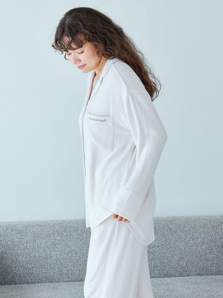 Woman wearing a snow long sleeve pajama shirt from Gelato Pique, showcasing luxurious sleepwear with lightweight fabric for comfort.