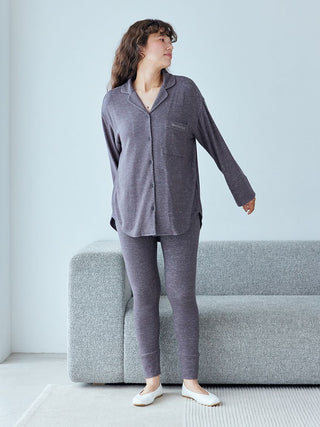 Woman wearing Snow Long Sleeve Pajama Shirt from Gelato Pique, standing in cozy home setting.