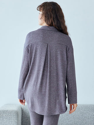 Woman wearing a soft, lightweight gray pajama shirt with long sleeves, showcasing casual elegance and comfort from Gelato Pique.