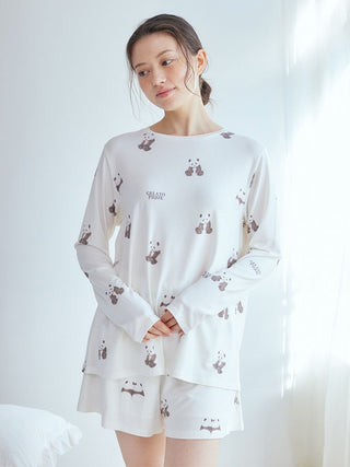 Woman wearing Gelato Pique USA's panda pattern long sleeve T-shirt in brown and white, premium loungewear and sleepwear.