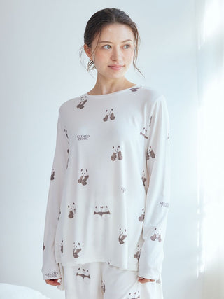 Woman wearing white Panda Pattern Long Sleeve T-Shirt with brown and pink panda illustrations, premium loungewear and sleepwear by Gelato Pique USA.