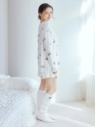 Woman wearing white Panda Pattern Long Sleeve T-Shirt by Gelato Pique USA, featuring soft brown and pink panda designs, premium loungewear.